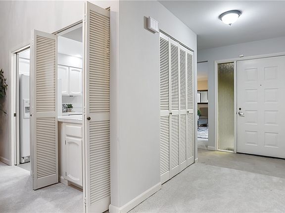 Perfectly placed guest closet off the main entrance keeps the area tidy. Entryway freshly painted, new carpet, and modern vinyl.