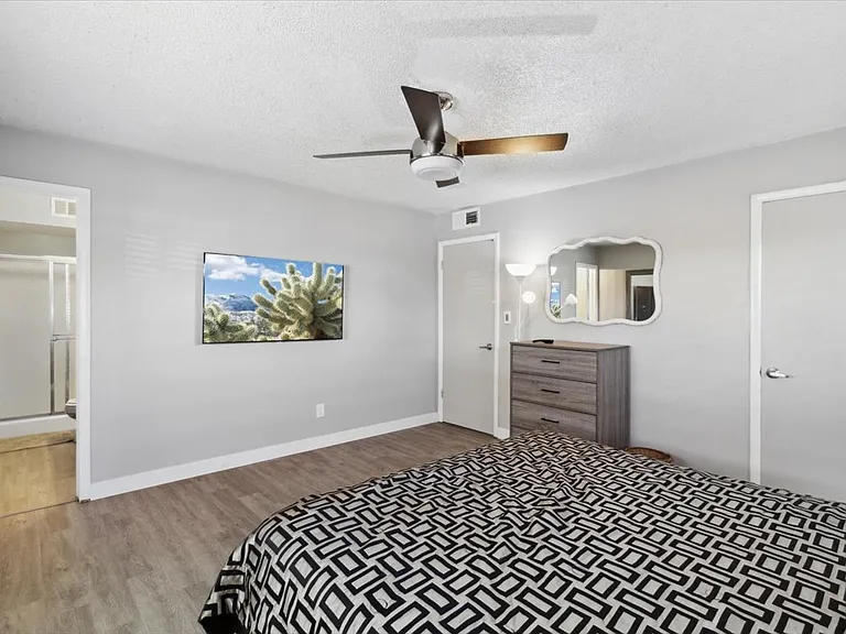 Bedroom 1 (Master): Walk-in closet and 55" Smart TV!