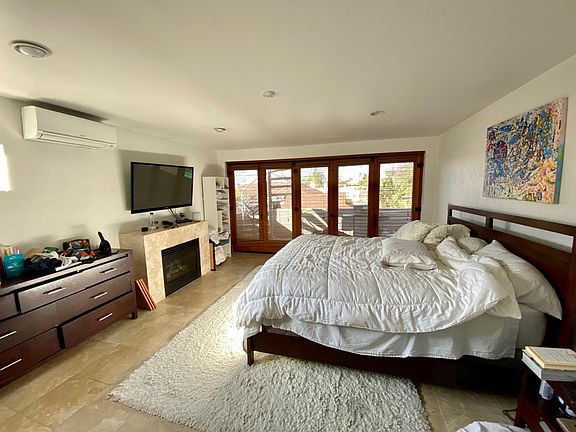 Master Bedroom is large, with Fireplace.and Full Bathroom. Air Handler on upper left wall - heat & Air Conditioning. Tenant Controlled. Five Bi-following Doors open to the lower Deck with Ocean Peek Spiral Stairs (Left side-outside) lead to 400 sq.f