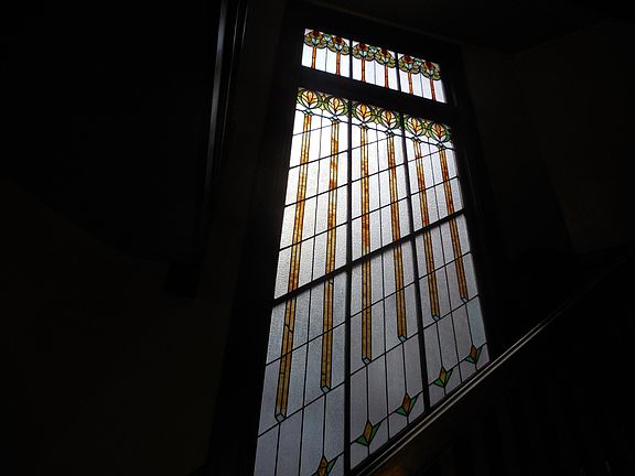 Stainedglass behind entry stairs