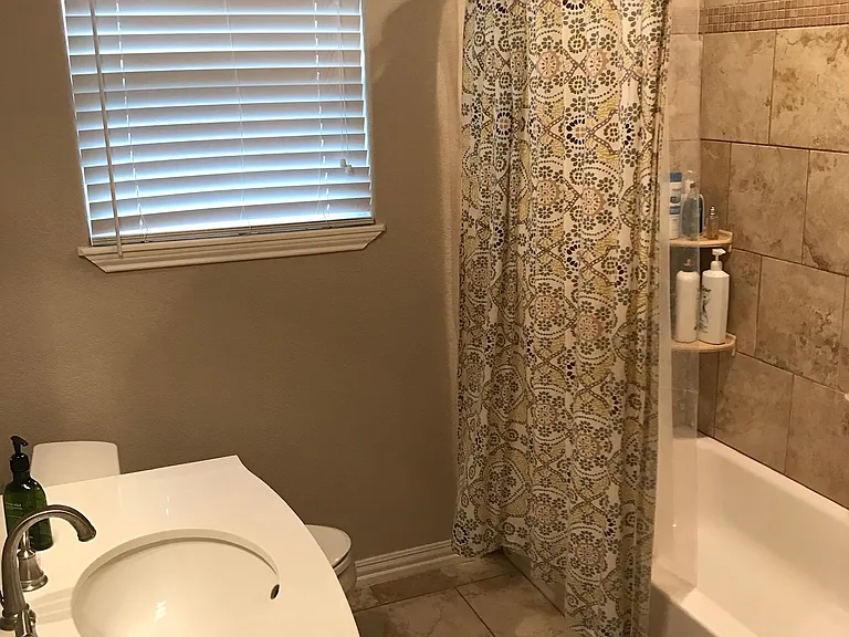 Hall Bathroom, with built in storage right outside the door - perfect for a linen closet!