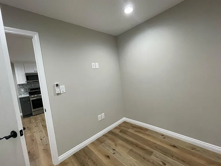 Exiting bedroom. Remote control to HVAC unit in bedroom.
