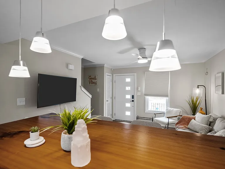 Large Smart TV, WiFi included, home work space at island, decorative pemdant lighting.