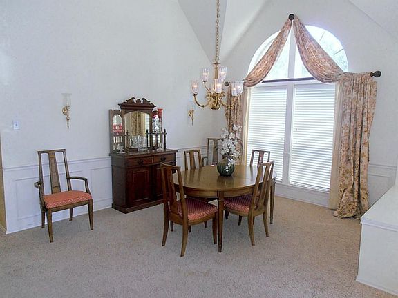 The formal dining room is easily expandable for family dinners.  Your largest table will fit in this room.