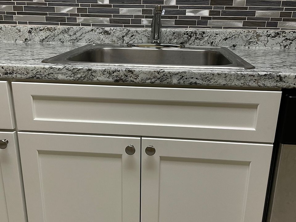newly remodeled cabinetry, countertop and backsplash