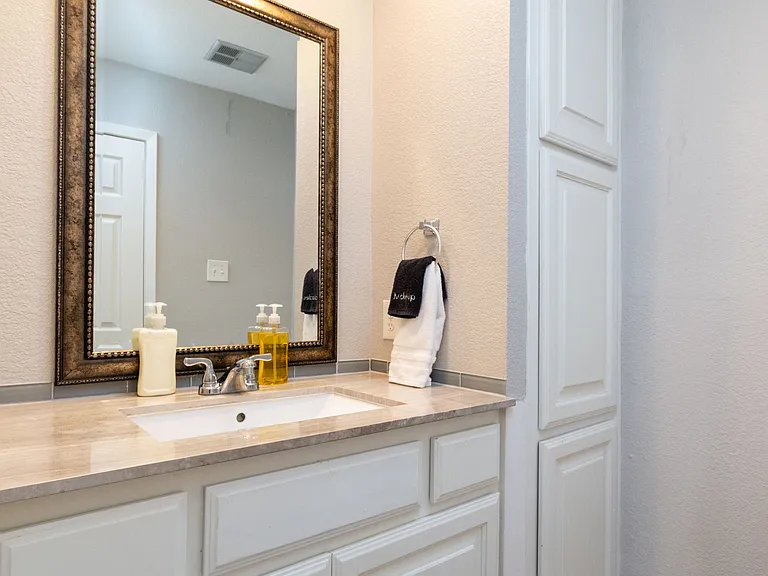Bathroom 1 with shower/tub combo with soap/shampoo/conditioner.