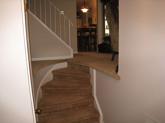Curved stairs to living room