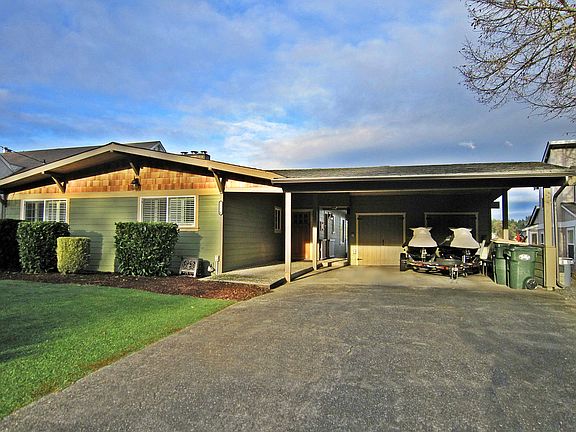 Plenty of parking in the driveway and under the carport.