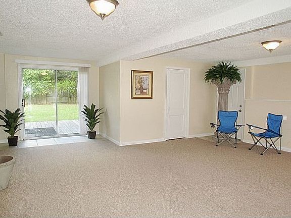 Large family room with sliding doors to deck
