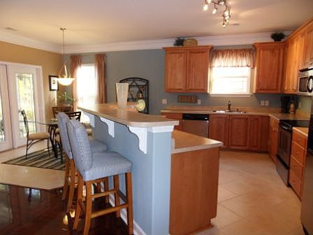 A huge, open kitchen with stainless steel appliances...