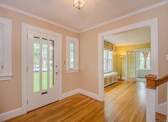 As you enter the foyer you ...