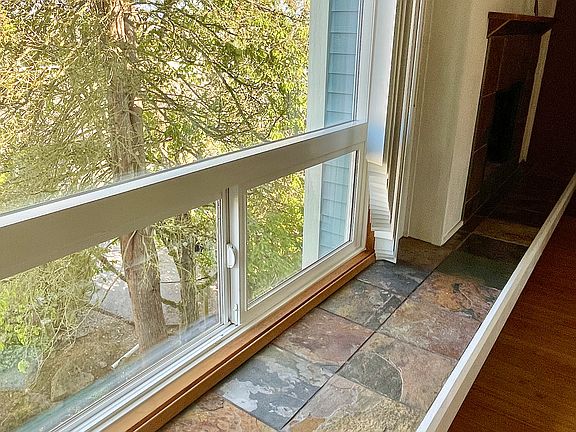 Wall to wall bay window seat with new tiles.