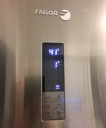 High end refrigerator with digital controls on exterior.