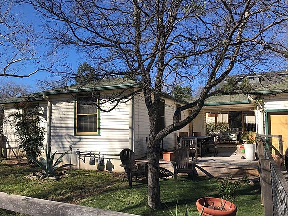 Big yard with recent Arbor trimmed trees, fenced for the dog