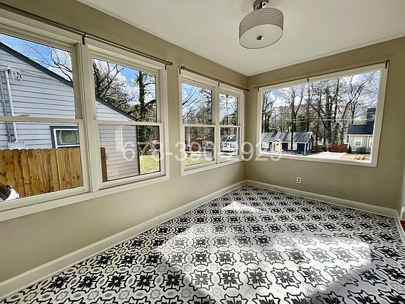 Heated/Cooled sunroom pefect den or home office