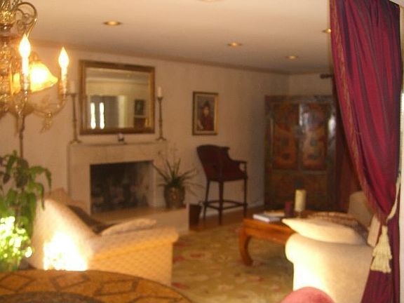 view of great room w/marble gas fireplace, hearth and mantle.