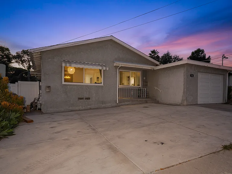 The home boasts a beautiful garage and a spacious driveway, providing ample parking for you and your guests.