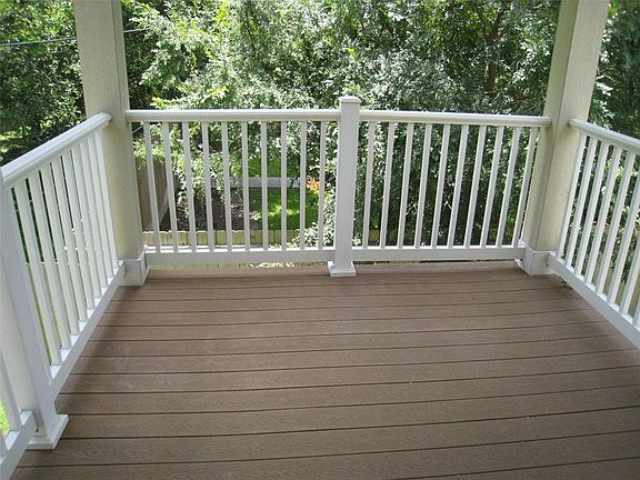 VIEW OF THE PORCH/DECK FROM THE KITCHEN,WITH PLENTY OF ROOM FOR YOUR TABLE,CHAIRS,ETC.!