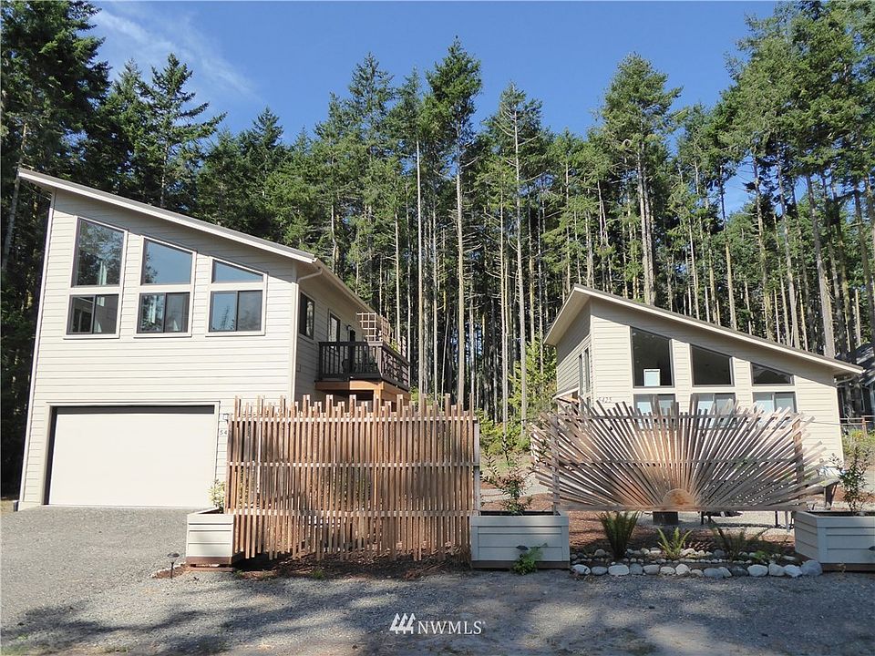 Welcome home to 5423 & 5425 Cleveland St. with charming & creative front fencing, flower boxes and plantings.