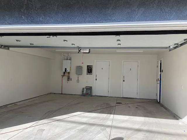 Two car enclosed garage is shared with the tenant in Unit B. One space is provided for parking only for each unit. A locked storage room is provided in front of the parking space, and EV charging is an option.
