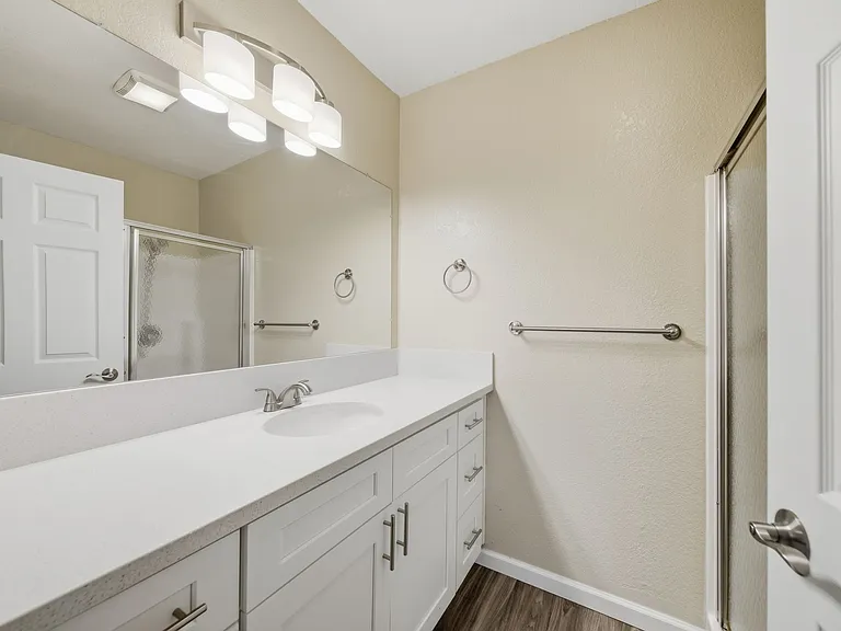 A Premium Primary Bathroom at Midway Gardens Apartments