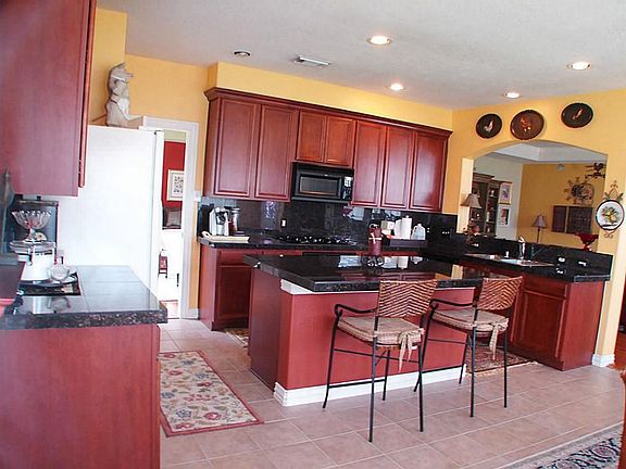 Open kitchen with lots of cabinets and lighten with Energy Star Appliances!