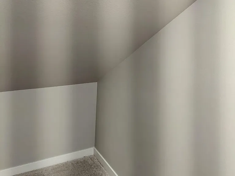 Under Staircase storage. Can accommodate big suitcases and anything extra.