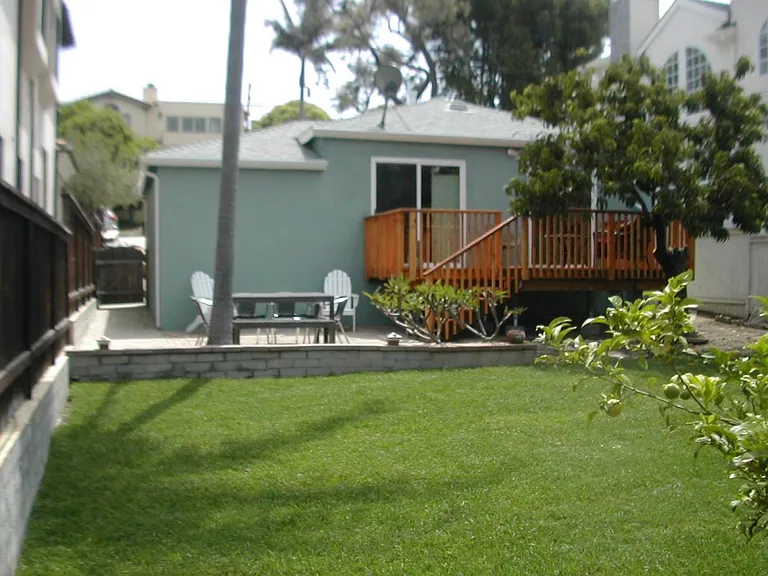 Back of house viewed from back of backyard