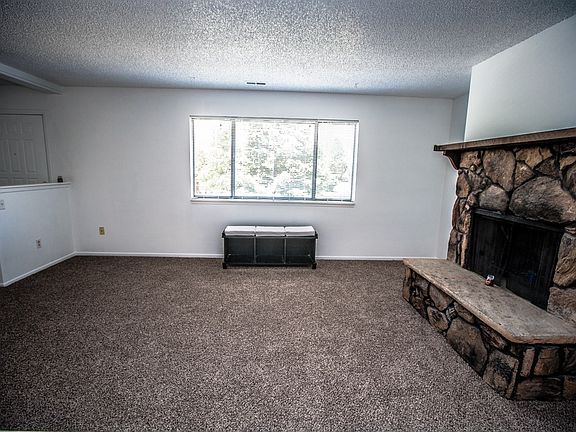 Front Room with Moss Rock Fireplace