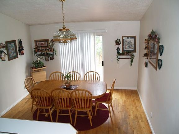 Dining area with hardwood floor, 2 tome paint throughout