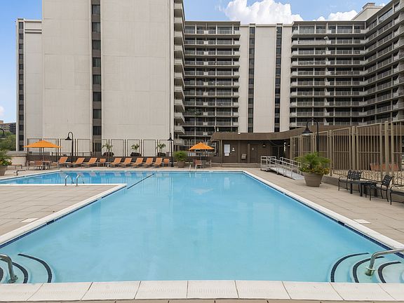 Sparkling Pool with Expansive Sundeck and Tanning Areas