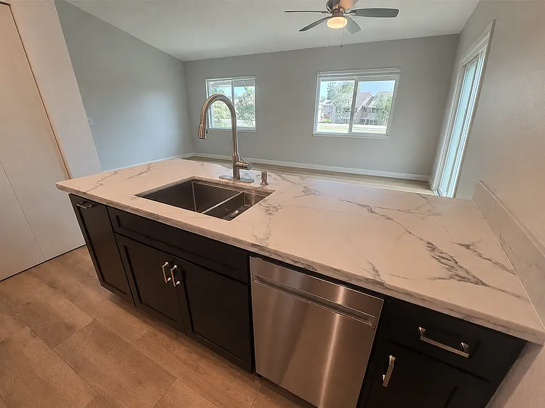 Beautiful Quartz countertop, dishwasher, large sink.
