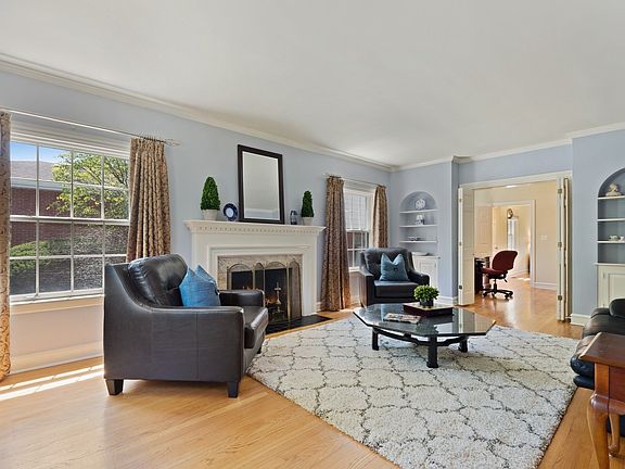 Classic Marble Fireplace and Arched Vintage-Style Built-Ins