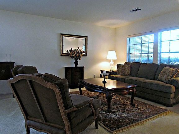 Welcome to your formal living room over looking the front yard.
