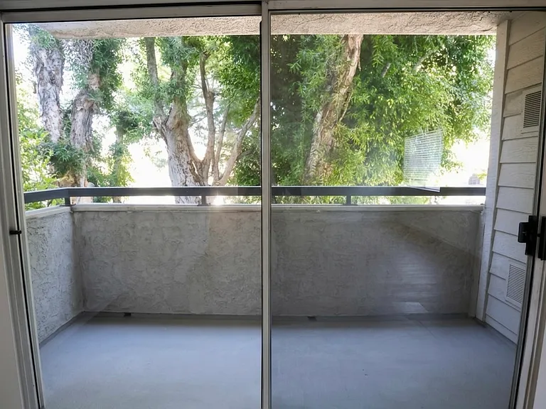 Living Room Balcony. Of note, this unit is not at street level.