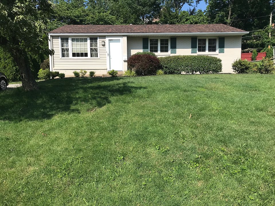 Front of house with yard and driveway (to left of house)