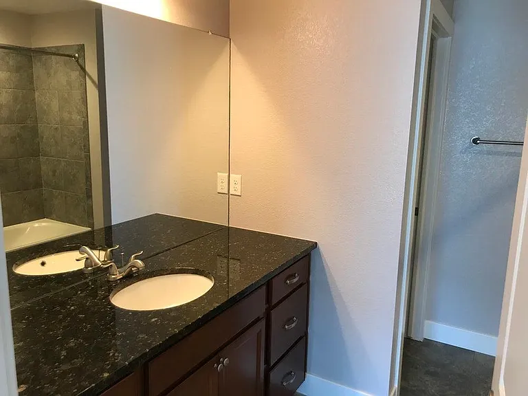 Master bathroom 2 with standard tub/shower and private toilet closet.