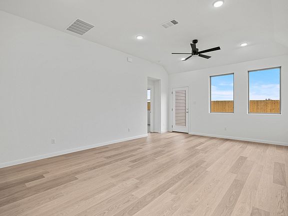 Living Room in the Birch home plan by Trophy Signature Homes - REPRESENTATIVE PHOTO