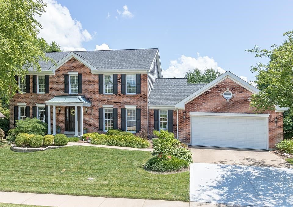 Front Elevation showing the beautifully manicured landscaping.