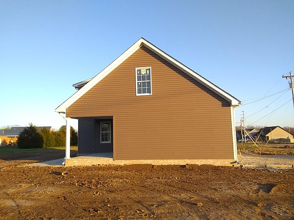 West side with view of bonus room window