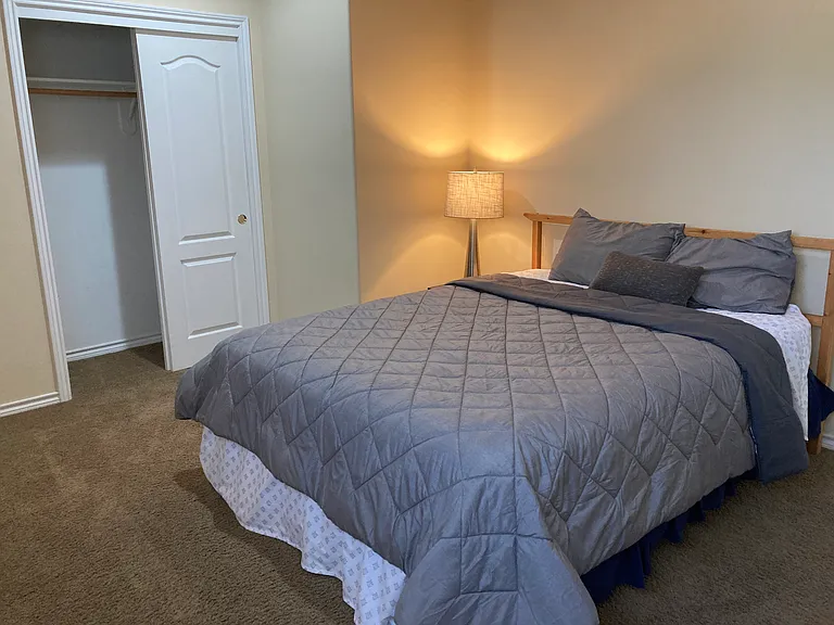This is the furnished bedroom- comfortable queen bed.
