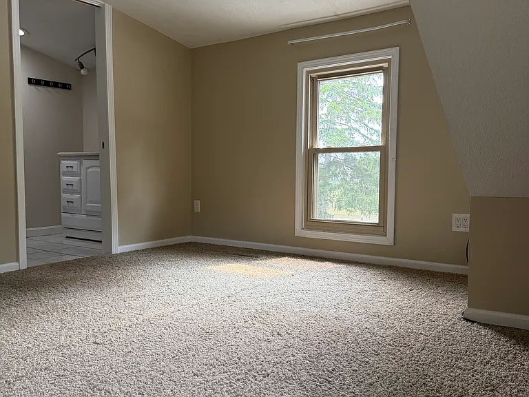 Upstairs bedroom with full bath