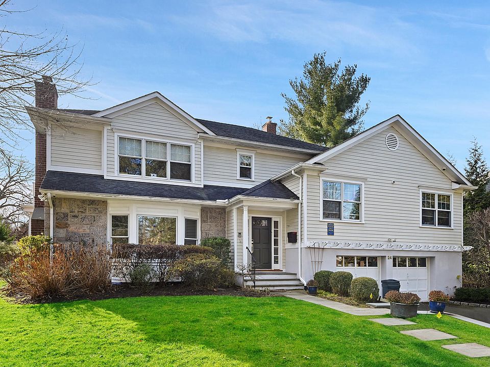 Move right into this expanded split level re-built in 2005 within very close proximity to Scarsdale Village and train.