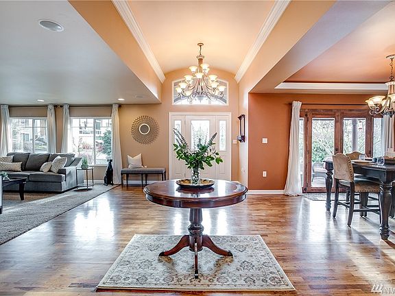 Swing open the door to find a grand and elegant foyer with beautiful hardwoods, tall ceilings, and luxurious molding.