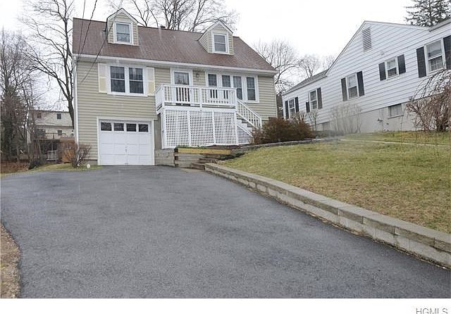 Front view of home with one car garage for easy access to the basement.