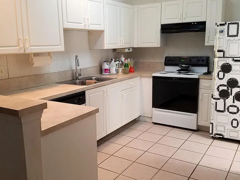 Kitchen - Tile Floor - Pantry Storage - Opens to Laundry and Garage