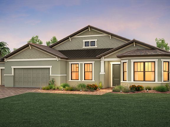 The Camelot, a one-story family home with a 3 car garage, shown with Home Exterior C2A