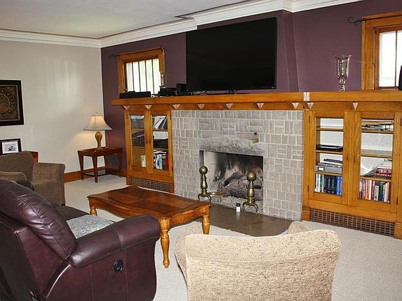 Fireplace with built in bookshelves