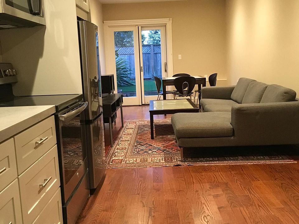Kitchenette and Living room looking into private yard.