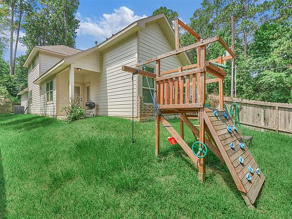Quaint backyard with the perfect amount of space to play but easy on the maintenance.